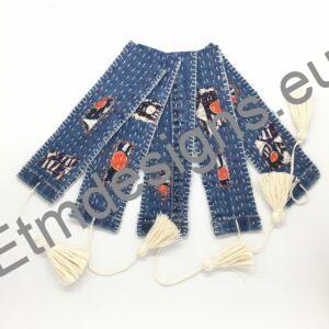 Textile bookmarks with hand embroidered details and visible mending, with tassel