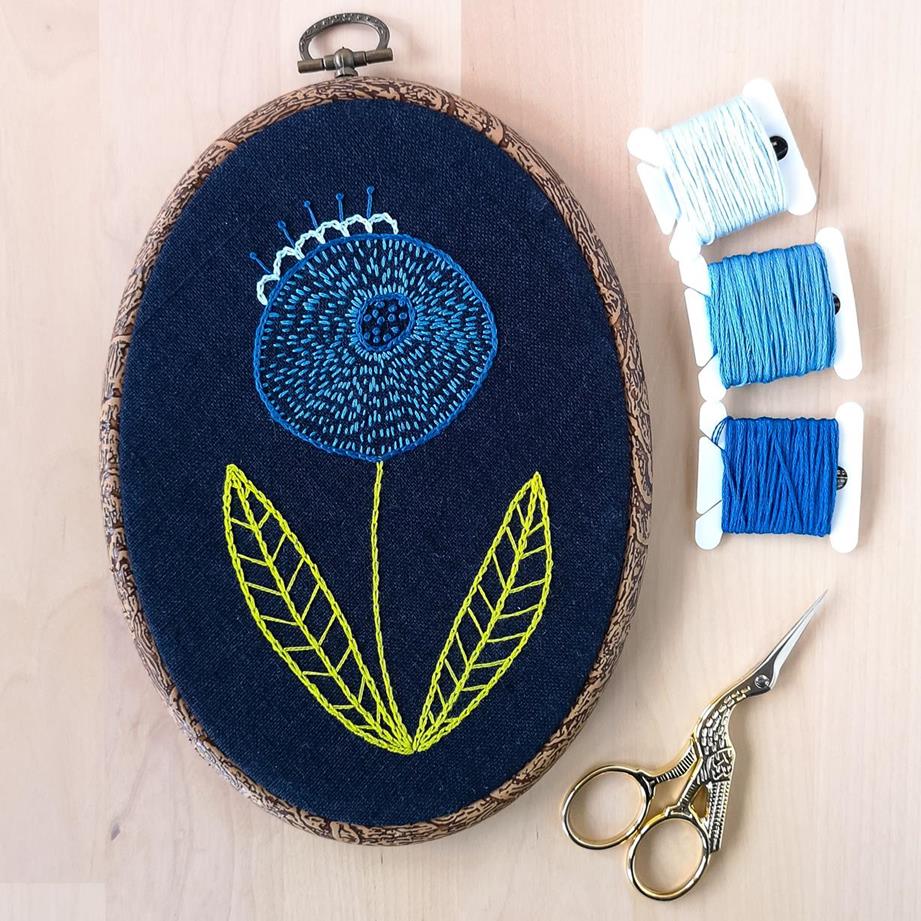 Hoop art - hand embroidered pictures 5 Blue modern flower on navy blue fabric hand embroidery in oval frame