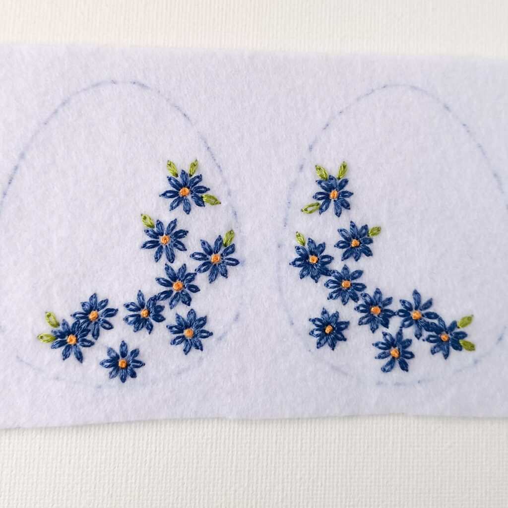 Easter egg with embroidered daisies